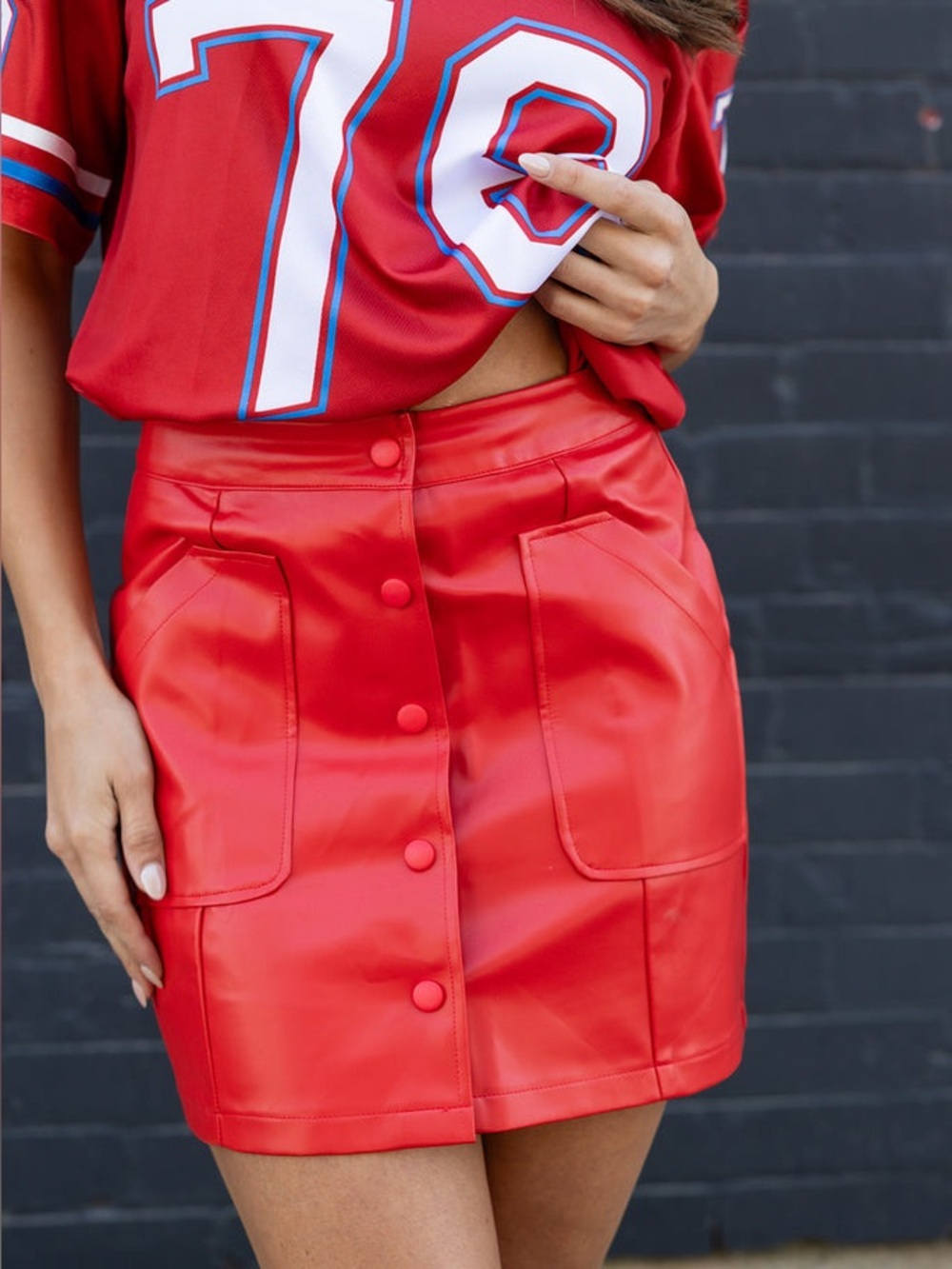 WKND CHAISERS The Main Stage Skirt 
Red faux leather button front skirt pockets